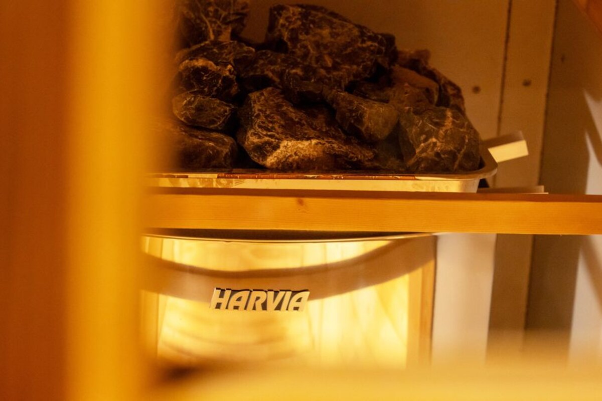 A storage unit with a label 'HARVIA' containing what appears to be food items.