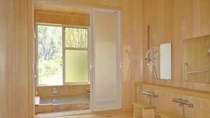A wooden-floored bathroom with a shower, a sink, and a mirror. - Shinshu Norikura Kogen Onsen Ryokuzansou (Matsumoto)