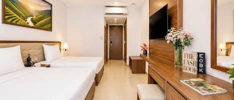 Family Triple Room, Garden View | In-room safe, desk, laptop workspace, blackout drapes