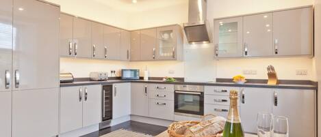 Oven, dishwasher, high chair, cookware/dishes/utensils