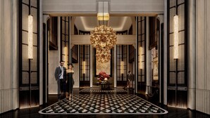 A grand lobby with a checkered floor, large chandeliers, and tall windows. - Wuhan Riverside Maxx Hotel (Wuhan)