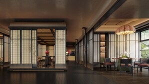 A traditional Japanese-style interior with tatami flooring, sliding doors, and a central seating area with a table and chairs. - Wuhan Riverside Maxx Hotel (Wuhan)