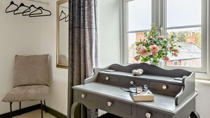A room with a desk, chair, window with view, and hanging clothes. - 2 Bed in Wells (oc-wesba) (Wookey Hole)