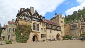 A historic building with a courtyard, large windows, and a prominent entrance. - 3 Bed in Morpeth (oc-63025) (Rothbury)