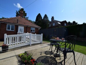 A residential property with a patio area, a white fence, and a garden. - 1 Bed in Knaresborough (oc-66981) (Knaresborough)