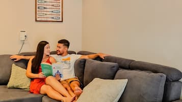 Family Double Room, Garden View | Living area | 50-inch Smart TV with digital channels