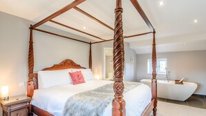 A four-poster bed with a wooden headboard, a fluffy throw blanket, and a nightstand with drawers. - 1 Bed in Harrogate (oc-79400) (Felliscliffe)