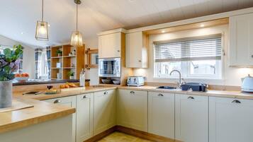Oven, dishwasher, high chair, cookware/dishes/utensils