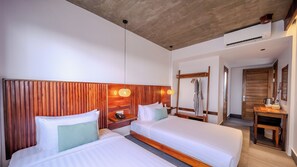 A hotel room with two beds, wooden headboard, hanging lamps, a wooden wardrobe, and a desk with a kettle. - Sonitori Riverside (Siem Reap)