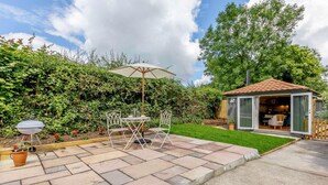 A patio with a grill, outdoor seating, and a small covered area. - 1 Bed in Wincanton (oc-83499) (Holton)