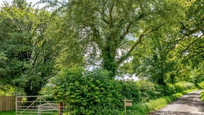 A rural road with a gate and a signpost. - 1 Bed in Wincanton (oc-83499) (Holton)