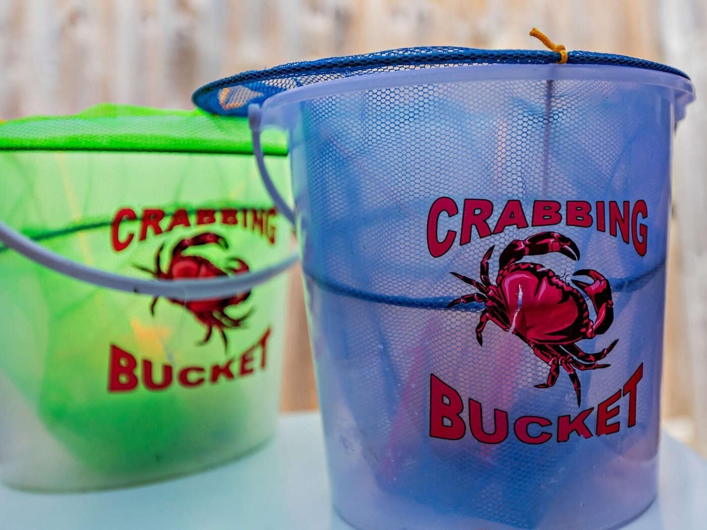 Two buckets with 'CRABBING BUCKET' text and crab illustrations.