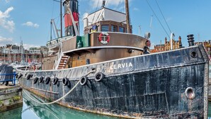A large, old ship docked at a marina with the name 'CERVIA' visible on its side. - 2 Bed in Ramsgate (oc-86126) (Ramsgate)