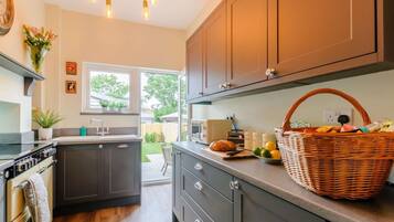 Oven, dishwasher, high chair, cookware/dishes/utensils