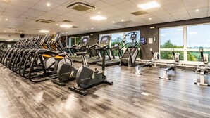 A gym with treadmills, elliptical machines, and weight equipment. - 3 Bed in Saltash (oc-87716) (Saint Mellion)