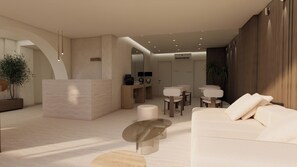 A modern hotel lobby with a reception desk, seating area, and a staircase leading to another level.