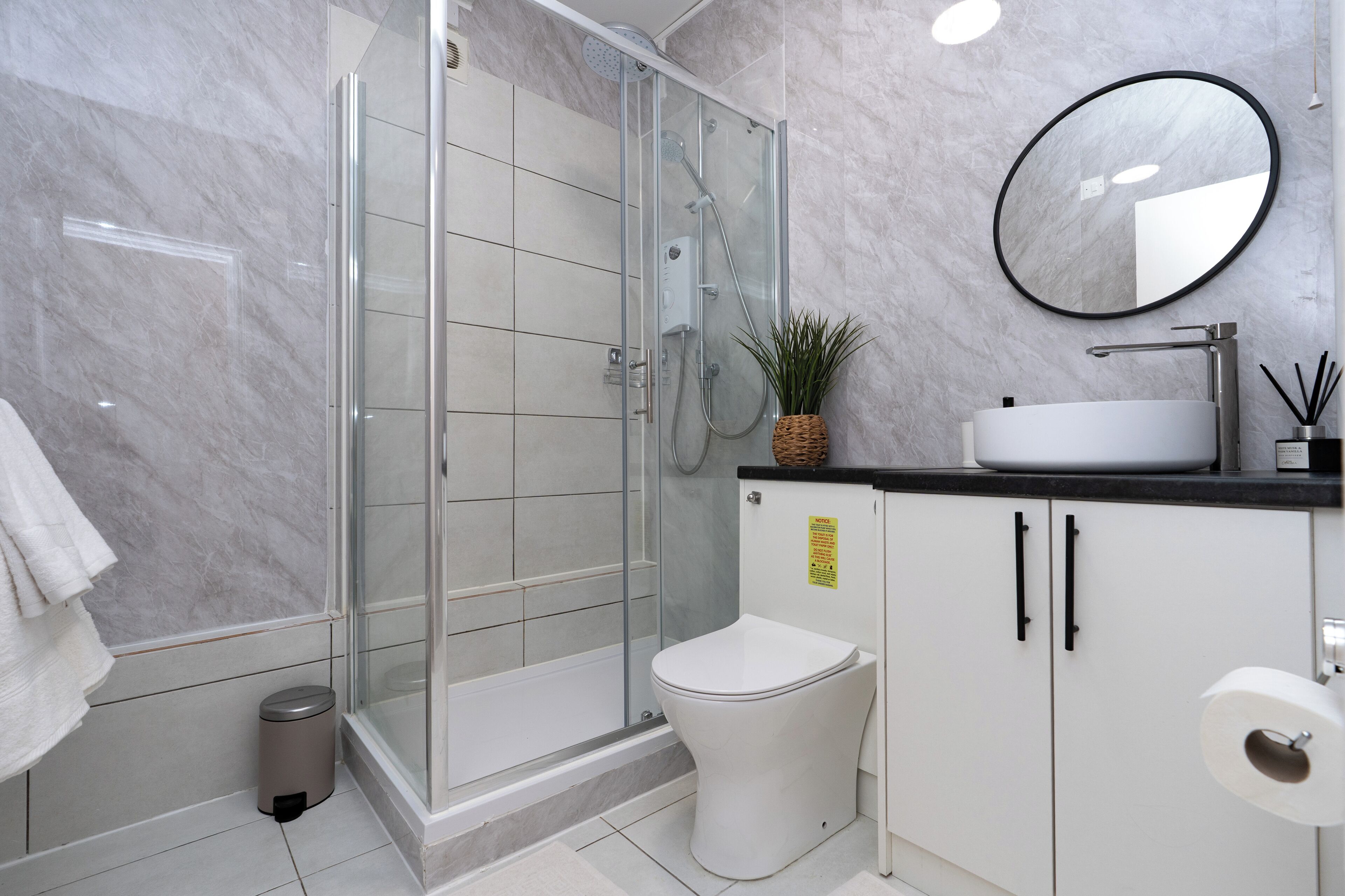 Shower, hair dryer, towels, shampoo