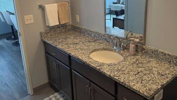 Shower, hair dryer, towels, toilet paper