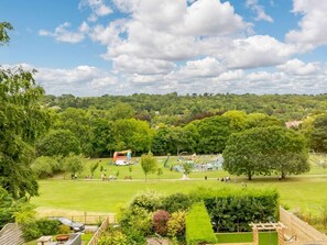 A park with a playground, a large grassy field, and trees. - 2 Bed in Ilkley (oc-89554) (Ilkley)
