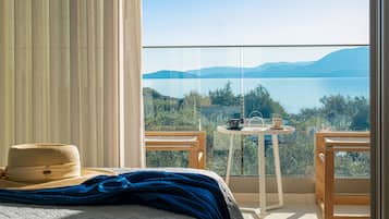 Deluxe Room, Balcony, Sea View | In-room safe, desk, soundproofing, iron/ironing board