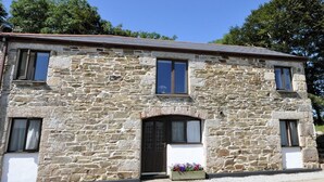 A stone building with a central entrance, two windows on the upper floor, and a flower box in front. - 2 Bed in Camborne (oc-oldmm) (Camborne)