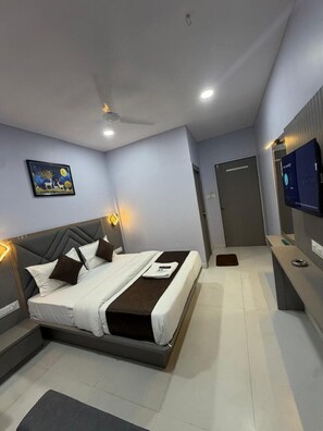 Deluxe Double Room, City View | In-room safe, desk, laptop workspace, iron/ironing board - Hotel ICON (Ahmedabad)