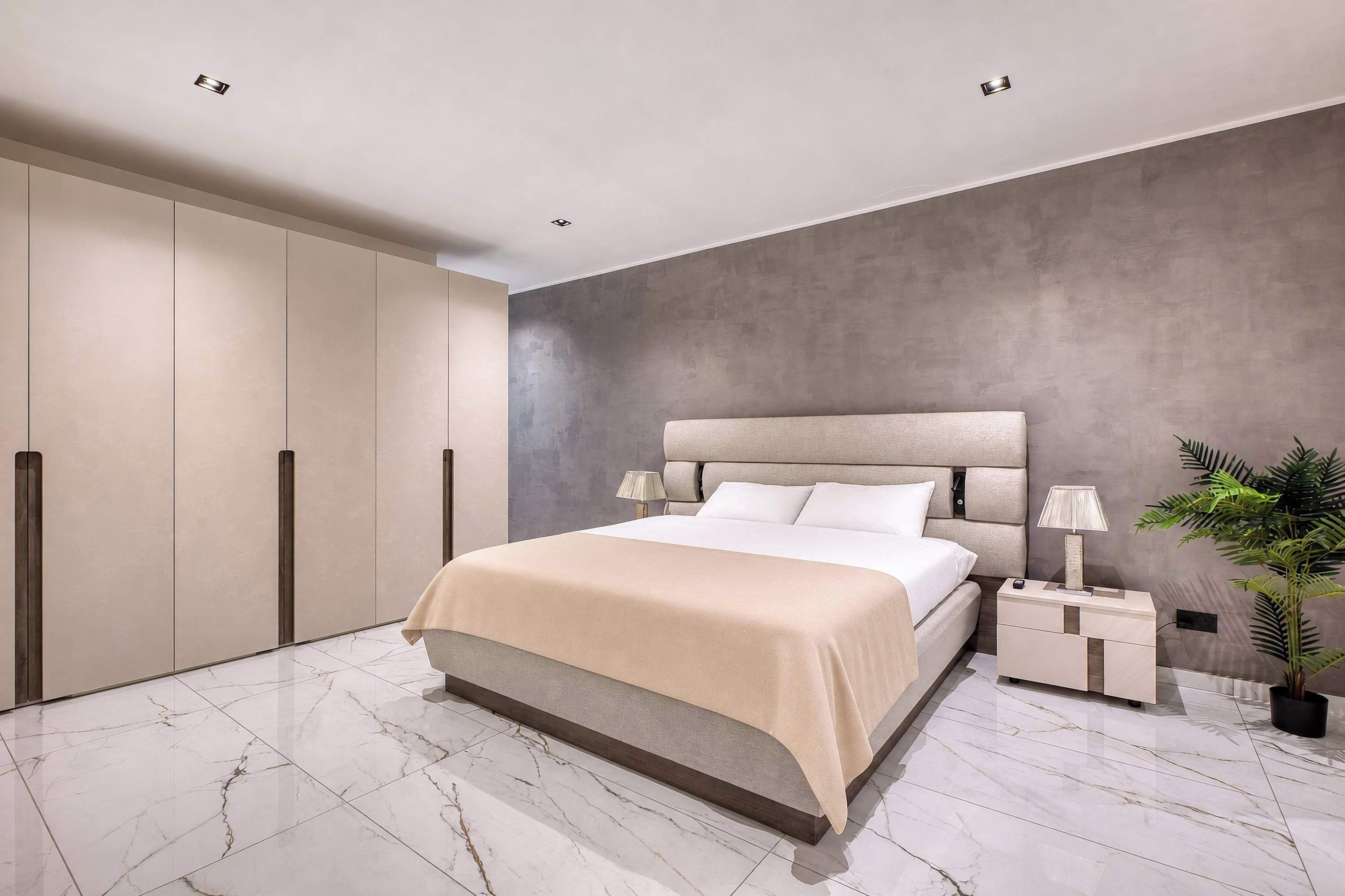 Un dormitorio moderno con una cama grande, una mesita de noche, una planta en maceta y un armario.