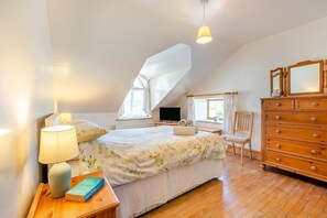 A bedroom with a bed, bedside lamp, dresser, and a television. - 5 Bed in Preston (oc-40993) (Pilling)