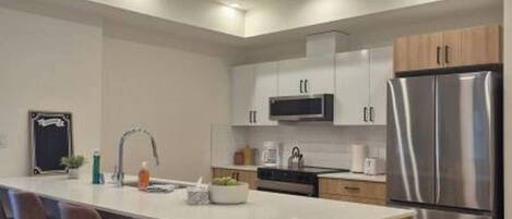 Coffee/tea maker, fridge, microwave, oven