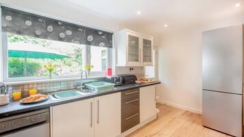Oven, dishwasher, high chair, cookware/dishes/utensils