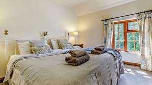 A bedroom with a bed, pillows, a window with curtains, and a radiator. - 4 Bed in Hereford (oc-44213) (Hereford)