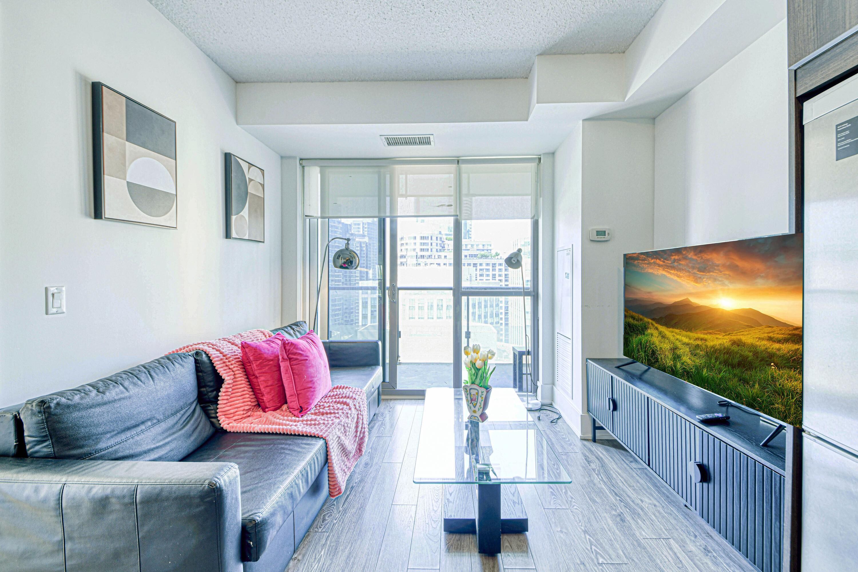 Comfort Apartment | Living area | 50-inch flat-screen TV with digital channels, streaming services