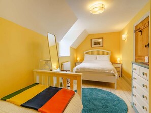 A bedroom with a bed, bedside tables, a dresser, a mirror, and a window. - 3 Bed in Abergavenny (oc-48309) (Forest Coal Pit)