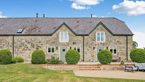 A stone building with a gabled roof, multiple windows, and a front entrance. - 3 Bed in Shaftesbury (oc-48804) (East Melbury)