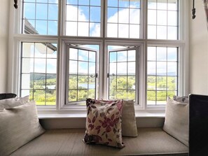 A room with a large window overlooking a scenic landscape. - 2 Bed in Hawkshead (oc-llh32) (Claife)