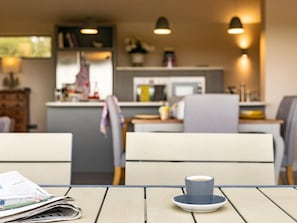 A dining area with a table, chairs, and a cup on the table. - 2 Bed in Diss (oc-51468) (Burgate Little Green)