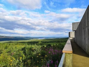 A wooden deck overlooking a forested landscape with a clear sky. - 3 Bed in Wylam (oc-51738) (Wylam)