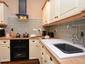 A kitchen with a dishwasher, oven, stove, and a sink with a faucet. - 3 Bed in Wylam (oc-51738) (Wylam)