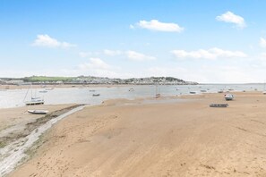 A beach with boats and a distant town. - 1 Bed in Bideford (oc-q43354) (Instow)