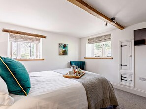 A bedroom with a bed, a window, a door, and a painting. - 4 Bed in Honiton (oc-53068) (Payhembury)