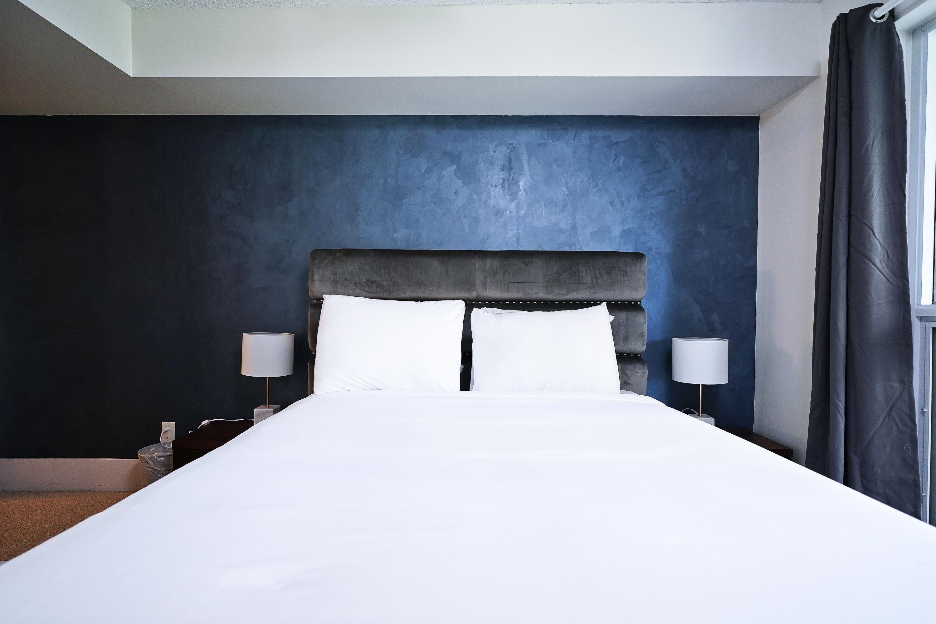 Departamento Deluxe, varias camas | Tabla de planchar con plancha, wifi gratis y ropa de cama 