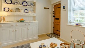 A kitchen with white cabinetry, a white countertop, and a window with blinds. - 1 Bed in Eastbourne (oc-ehc45) (Eastbourne)