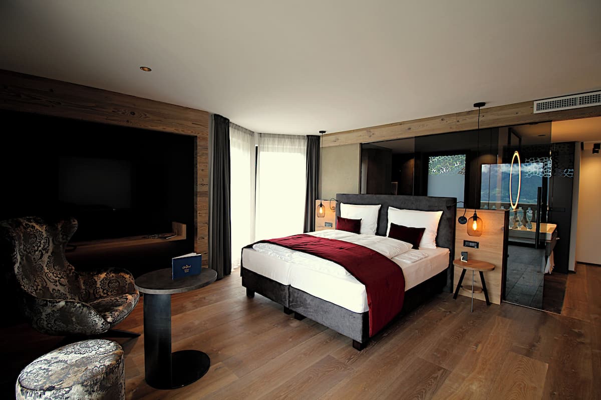 Luxury Suite, Balcony, Garden View | Premium bedding, minibar, in-room safe, blackout drapes