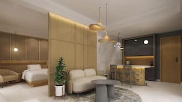 Une chambre d’hôtel moderne dotée d’un canapé, d’un coin repas et d’un comptoir de cuisine.