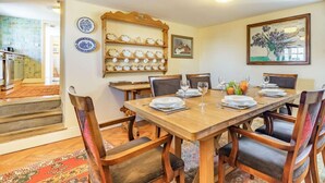 A dining room with a wooden table set for four, surrounded by chairs with cushioned seats. - 4 Bed in Consett (oc-cn108) (Hunstanworth)