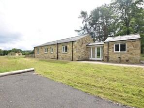 A stone building with a covered porch and a door. - 3 Bed in Rowlands Gill (oc-cn209) (Rowlands Gill)