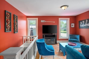Smart TV, fireplace, books