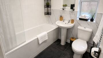 Hair dryer, towels, soap, toilet paper