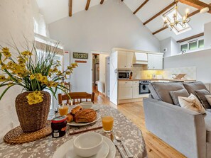 A cozy living room with a dining area, a kitchen, and a staircase leading to an upper level. - 1 Bed in Beaworthy (oc-wvopa) (Ashwater)