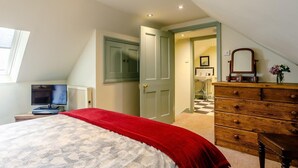 A bedroom with a bed, dresser, and a television. - 1 Bed in Matlock (oc-61938) (Tansley)